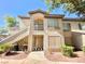 Attractive condo building featuring private balconies and well-manicured shrubbery at 5710 E Tropicana Ave # 1055, Las Vegas, NV 89122