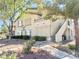 Charming two-story condo with lush landscaping and a convenient stairway access at 5710 E Tropicana Ave # 1055, Las Vegas, NV 89122