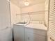 Laundry area with a washer and dryer, shelving, and closet for storage at 5710 E Tropicana Ave # 1055, Las Vegas, NV 89122