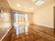 Inviting living room with stylish flooring, sliding doors to balcony, and neutral paint at 5710 E Tropicana Ave # 1055, Las Vegas, NV 89122