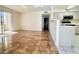Open living space featuring glossy tile flooring and sliding glass door to a balcony at 5710 E Tropicana Ave # 1055, Las Vegas, NV 89122