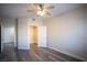 Bedroom with wood-look floors, a ceiling fan, and closet at 6160 Rumrill St # 121, Las Vegas, NV 89113