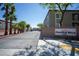 Cimarron Hills community entrance with palm trees and brick sign featuring community name at 6160 Rumrill St # 121, Las Vegas, NV 89113
