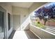 Covered patio featuring stucco walls, a backyard view, and direct access to the main bedroom at 6160 Rumrill St # 121, Las Vegas, NV 89113