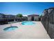 A clear view of the community pool and hot tub surrounded by lush landscaping at 6160 Rumrill St # 121, Las Vegas, NV 89113