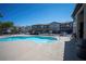 Exterior view of a clean community pool area with ample space for relaxation and recreation at 6160 Rumrill St # 121, Las Vegas, NV 89113