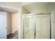 Bright shower with tile surround and glass doors at 6160 Rumrill St # 121, Las Vegas, NV 89113