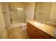 Well-lit bathroom featuring a shower-tub combo and a single sink with granite countertops at 62 E Serene Ave # 129, Las Vegas, NV 89123