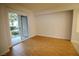 Bedroom with hardwood floors, a sliding glass door leading to a patio at 62 E Serene Ave # 129, Las Vegas, NV 89123