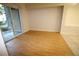 Bright bedroom with hardwood floors and a glass door that leads to a balcony at 62 E Serene Ave # 129, Las Vegas, NV 89123