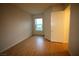 Cozy bedroom with hardwood floors and natural light from the window at 62 E Serene Ave # 129, Las Vegas, NV 89123