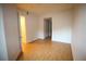 Spacious bedroom with laminate floors and access to an ensuite bathroom at 62 E Serene Ave # 129, Las Vegas, NV 89123