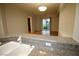Granite-topped bar overlooking bright living area, perfect for entertaining at 62 E Serene Ave # 129, Las Vegas, NV 89123