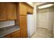Ample storage with wood cabinetry and modern appliances against a neutral backdrop at 62 E Serene Ave # 129, Las Vegas, NV 89123