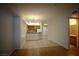 Open-concept space with tile and laminate floors, connecting kitchen, bath and living areas at 62 E Serene Ave # 129, Las Vegas, NV 89123
