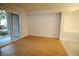 Bright living room with wood floors, access to the outside, and an archway detail at 62 E Serene Ave # 129, Las Vegas, NV 89123