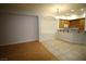 Inviting living room featuring tile and hardwood flooring, and a view into the kitchen at 62 E Serene Ave # 129, Las Vegas, NV 89123