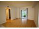 Inviting living area with sliding glass door to outdoor space and laminate flooring at 62 E Serene Ave # 129, Las Vegas, NV 89123