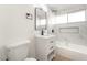 Stylish bathroom boasts modern vanity, black fixtures, and a tiled shower-tub combo at 6205 Hargrove Ave, Las Vegas, NV 89107