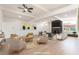 Bright living room featuring modern decor, a cozy fireplace, and ample natural light at 6205 Hargrove Ave, Las Vegas, NV 89107