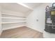Functional storage room with built-in shelving and water heater, maximizing space at 6205 Hargrove Ave, Las Vegas, NV 89107