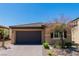 Charming single-story home with a desert-landscaped yard and a two-car garage at 6829 Painted Morning Ave, Las Vegas, NV 89142
