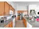 Modern kitchen with granite countertops, stainless steel appliances, and plenty of cabinet storage space at 6829 Painted Morning Ave, Las Vegas, NV 89142