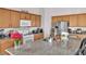 Island kitchen featuring granite countertops, stainless steel appliances, and ample storage space at 6829 Painted Morning Ave, Las Vegas, NV 89142