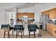Island kitchen with stainless steel appliances, granite countertops, and tile backsplash at 6829 Painted Morning Ave, Las Vegas, NV 89142