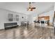Bright, open-concept living space with hardwood floors seamlessly connecting to the kitchen at 6829 Painted Morning Ave, Las Vegas, NV 89142