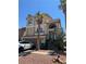 Charming two-story home features a stucco exterior, arched windows, and a well-manicured front yard at 6877 Philharmonic Ave, Las Vegas, NV 89139