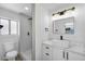 Modern bathroom features a glass shower, updated vanity, and marble counter at 6939 Paddington Way, Las Vegas, NV 89147