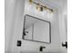 Stylish bathroom showcasing a black framed mirror and modern vanity lighting at 6939 Paddington Way, Las Vegas, NV 89147