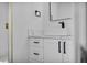 Elegant bathroom with a white vanity, undermount sink and black hardware at 6939 Paddington Way, Las Vegas, NV 89147