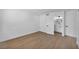 Clean, well-lit bedroom with hardwood floors, light walls, and a door to a bathroom at 6939 Paddington Way, Las Vegas, NV 89147