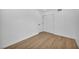 Simple bedroom features wood-look flooring, closet, and minimalist design at 6939 Paddington Way, Las Vegas, NV 89147