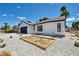 Attractive single-story home with low-water rock landscaping and a neatly arranged succulent garden at 6939 Paddington Way, Las Vegas, NV 89147