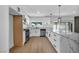 Modern kitchen with stainless steel appliances, granite countertops, and ample cabinet space at 6939 Paddington Way, Las Vegas, NV 89147
