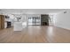 Spacious open concept living space with fireplace, kitchen island, and backyard access at 6939 Paddington Way, Las Vegas, NV 89147