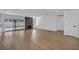 Bright living room with hardwood floors, modern fireplace, and sliding glass doors to the outdoor area at 6939 Paddington Way, Las Vegas, NV 89147
