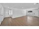 Bright and inviting main room with wood floors, recessed lighting, and neutral walls at 6939 Paddington Way, Las Vegas, NV 89147