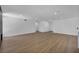 Minimalist living room with wood-look flooring, recessed lighting, and an open floor plan at 6939 Paddington Way, Las Vegas, NV 89147