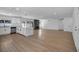 Spacious open floor plan with a kitchen island, modern cabinets, and ample natural light at 6939 Paddington Way, Las Vegas, NV 89147