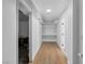 Storage room with wood-look floors and custom shelving at 6939 Paddington Way, Las Vegas, NV 89147