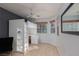 Bright bedroom with a lofted bed, built in desk, and neutral colored walls at 7697 Morning Lake Dr, Las Vegas, NV 89131