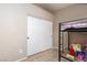 Neutral bedroom with a bunk bed, light tile flooring and double-door closet at 7697 Morning Lake Dr, Las Vegas, NV 89131