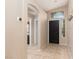 Inviting foyer featuring tile flooring and high ceilings and natural light at 7697 Morning Lake Dr, Las Vegas, NV 89131