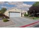 Charming single-story home featuring a two-car garage and well-maintained landscaping at 7697 Morning Lake Dr, Las Vegas, NV 89131
