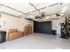 Organized garage with sealed floors and cabinet storage, offering extra storage space at 7697 Morning Lake Dr, Las Vegas, NV 89131
