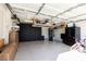 Spacious garage with sealed flooring and cabinet storage, offering extra storage space at 7697 Morning Lake Dr, Las Vegas, NV 89131